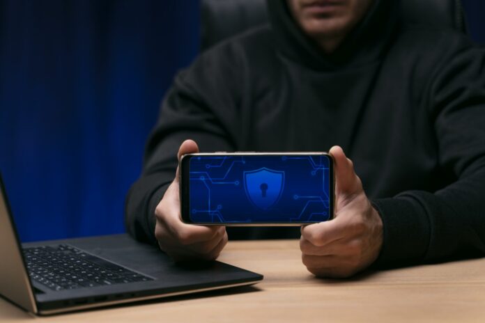 close-up-programmer-holding-phone-2048x1366-1.jpg